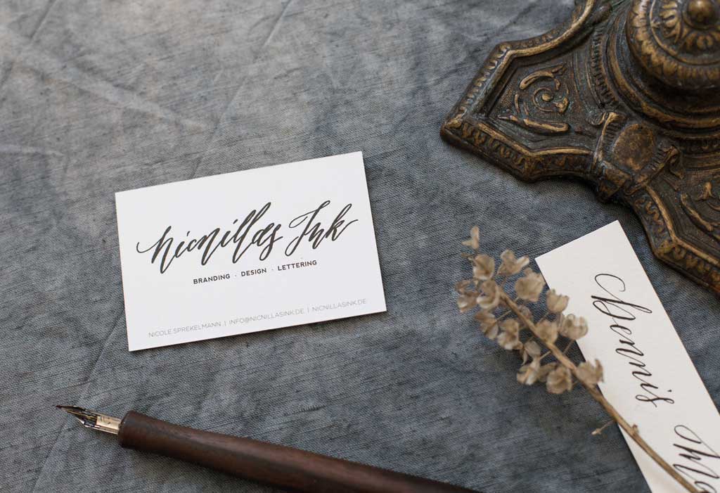 Business card with modern calligraphy hand lettered logo